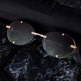 2025 New Oval Frameless Sunglasses European and American Retro Punk Sunglasses Stage Performance Fashion Street Beat Glasses